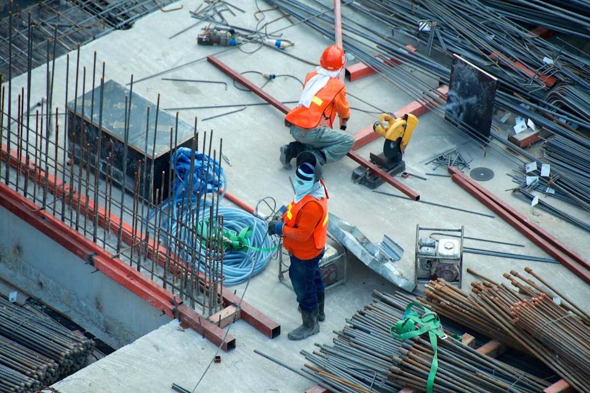 Active construction site with skilled trades workers - representing the need for qualified construction labor in Virginia